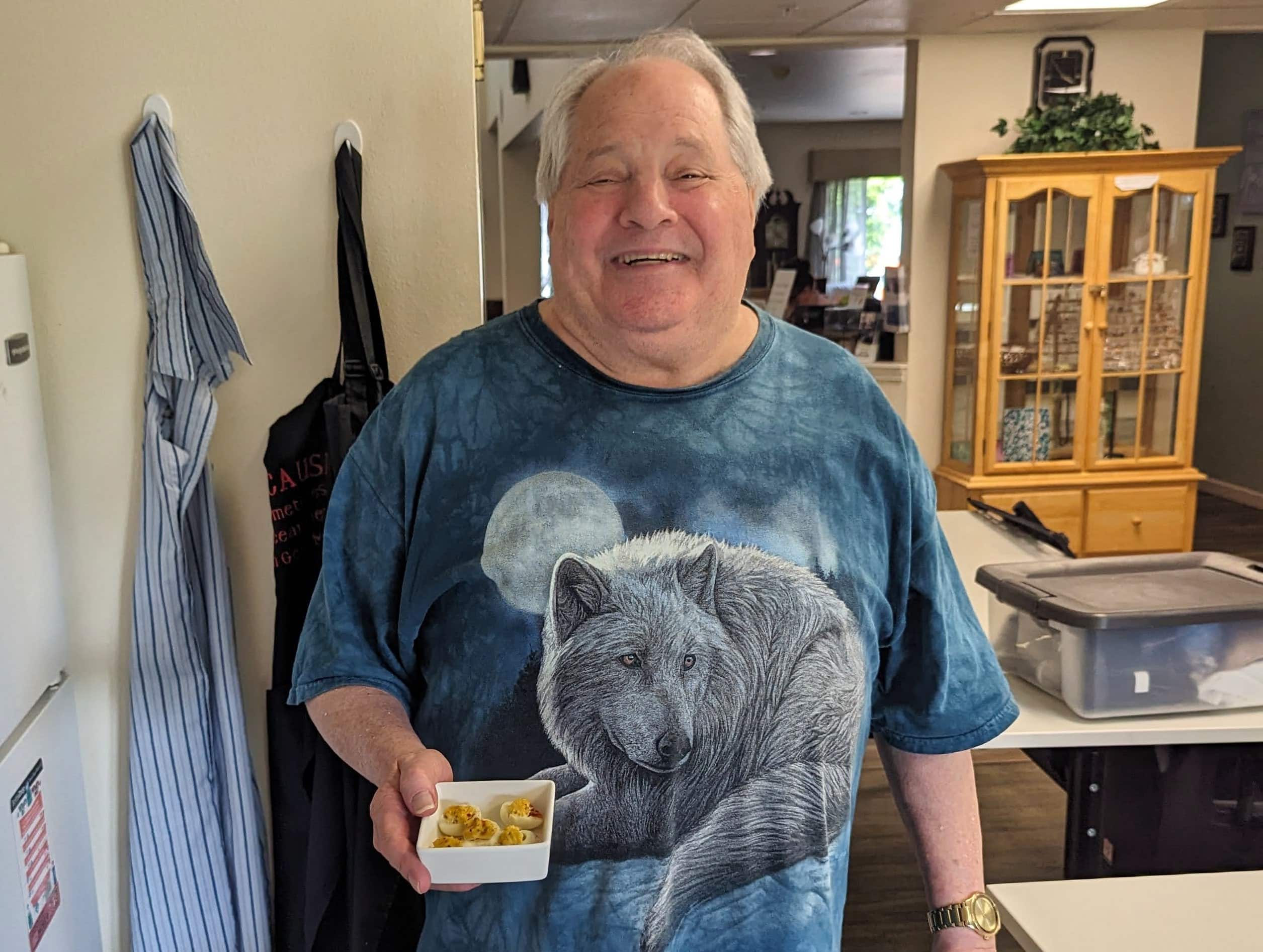 Senior holding a bowl of food